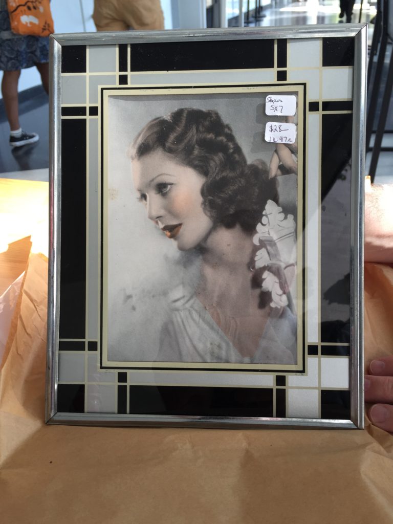 Loretta Young photo in a Deco reverse painted frame.